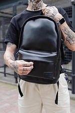 Large black youth backpack with laptop compartment and external pocket